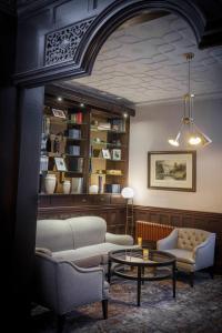 a living room with a couch and a coffee table at Chesford Grange Hotel in Kenilworth