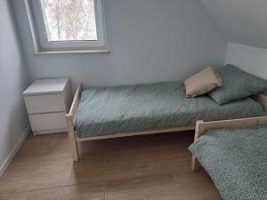 Posteľ alebo postele v izbe v ubytovaní Słoneczna Sielanka domki w Bieszczadach