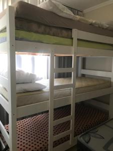 a couple of bunk beds in a room at Sobrado in Curitiba