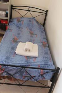 a chair with a cat sleeping on top of it at Athens Riviera coast apartment in Athens +11 photos