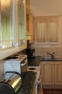 a kitchen with a sink and a counter top at Athens Riviera coast apartment in Athens