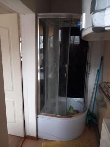 a glass door in a room with a bowl in it at Balvu centrs Partizanu 10 in Balvi