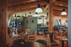 a restaurant with tables and chairs in a room at Smart Hotel Renzi in Folgarida +44 photos