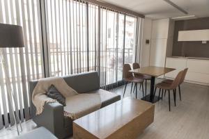 a living room with a couch and a table at Babel Nueva Córdoba in Córdoba
