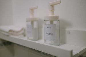 a bottle of soap on a shelf in a laboratory at Prime Living in Guildford