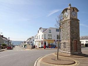 a clock tower in the middle of a street at Sandy House in Rhosneigr