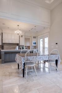 a kitchen with a dining room table and chairs at Luxurious Private Rooms in Richmond in Richmond