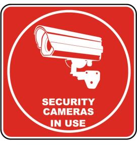a red security cameras in use sign at 2020 Travelers Inn in Dumaguete