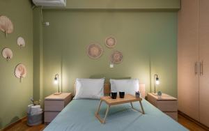 A bed or beds in a room at Plaka Apartment With Terrace View