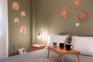 A bed or beds in a room at Plaka Apartment With Terrace View