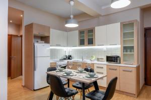 A kitchen or kitchenette at Plaka Apartment With Terrace View