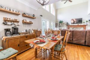 a kitchen and living room with a wooden table and chairs at Blackjack Acres in Marietta