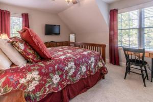 a bedroom with a bed and a table with a chair at Blackjack Acres in Marietta