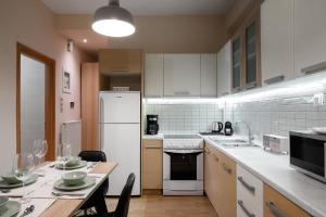 A kitchen or kitchenette at Plaka Apartment With Terrace View
