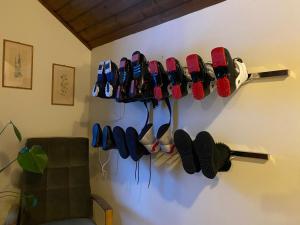 a rack of shoes hanging on a wall at Landhaus Marmorata in Sattendorf