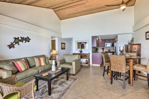a living room with a couch and a table at Beachfront Lahaina Condo - Featured on HGTV! in Kahana