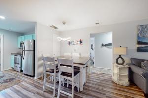 a kitchen and dining room with a table and chairs at Vinyard Ventures, Unit #3 in Branson