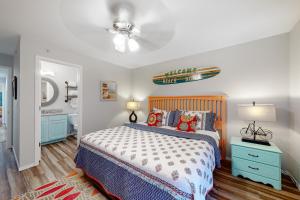 a bedroom with a bed and a ceiling fan at Vinyard Ventures, Unit #3 in Branson