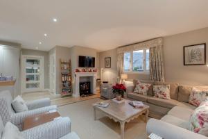 a living room with a couch and a table at Cedar Lodge in Portpatrick