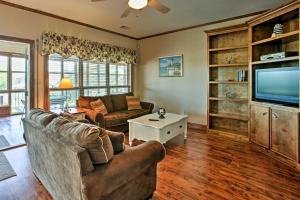 a living room with a couch and a tv at New Orleans Waterfront Home with Private Dock! in New Orleans