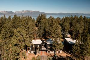 an aerial view of a house surrounded by trees at The Coachman Hotel in South Lake Tahoe