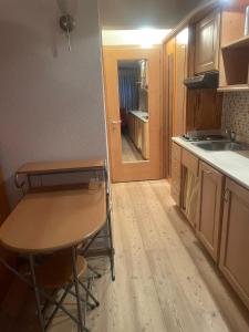 A kitchen or kitchenette at BAITA SOLE ALTO la tua casa sulle piste da sci