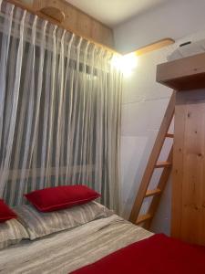 A bed or beds in a room at BAITA SOLE ALTO la tua casa sulle piste da sci