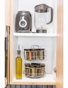 a shelf in a cupboard with some items on it at Desert Hideaway in Hurricane +11 photos