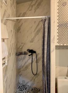 a bathroom with a shower with a shower at Comfort Home Soborna 283 in Rivne