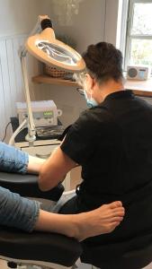 a man sitting in front of a machine at Aasesminde in Fåborg