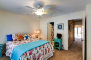 a bedroom with a bed and a ceiling fan at Destin Townhome with Balcony - Walk to the Beach! in Destin