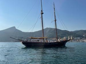 a large boat in the water with people on it at Casa Portanova 35 in Salerno