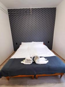Ein Bett oder Betten in einem Zimmer der Unterkunft Muskátli nyaraló