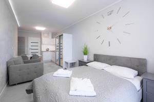 Łóżko lub łóżka w pokoju w obiekcie Balticus Apartamenty Standard Promenada Gwiazd 14