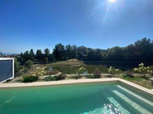 a swimming pool in a yard with a fence at Luxury Home - Vila Golfe Amarante in Amarante