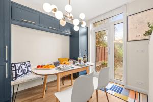 a dining room with a table with oranges on it at Spacious 3 bed house in North Leeds perfect for families & longer stays in Adel