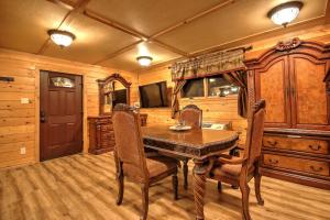 a dining room with a wooden table and chairs at Yellowstone Gateway Inn in Gardiner