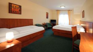 Postel nebo postele na pokoji v ubytování Hotel Palace