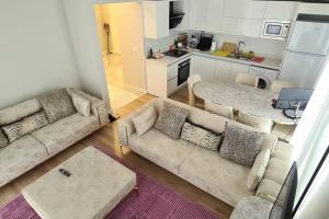 a living room with a couch and a kitchen at 2bedrooms 2washrooms with parking. near Starbucks in Istanbul