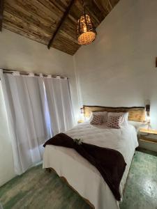 Postel nebo postele na pokoji v ubytování La Casita de Charo 2