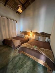 Postel nebo postele na pokoji v ubytování La Casita de Charo 2