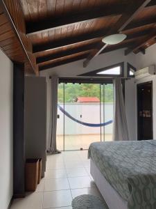 Ένα ή περισσότερα κρεβάτια σε δωμάτιο στο Cobertura Dos Amores Na melhor localização da Praia Brava- Balneário Camboriú