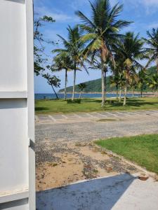 a view of the beach from a house at Pé na Areia Sons do Mar in Guarujá