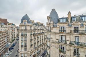 an aerial view of buildings in paris with cars at Apartments WS Tour Eiffel - Laos in Paris
