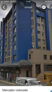 a truck parked in front of a large building at DEPARTAMENTO 2 EN PLENO CENTRO DE PUERTO MONTT in Puerto Montt