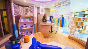 a childrens room with a play area with a slide at InterContinental Pattaya Resort by IHG in Pattaya South