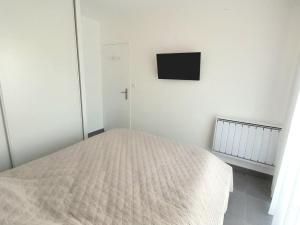 Posteľ alebo postele v izbe v ubytovaní Appartement NEUF 1 chambre, 4 pers, 350m plage Saint Jean de Monts, calme, forêt, commerces à proximité - FR-1-323-268
