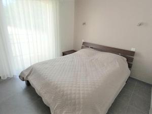 Posteľ alebo postele v izbe v ubytovaní Appartement NEUF 1 chambre, 4 pers, 350m plage Saint Jean de Monts, calme, forêt, commerces à proximité - FR-1-323-268