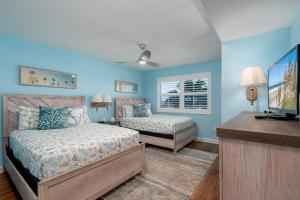 Voodi või voodid majutusasutuse Spectacular Gulf Front Corner Unit condo toas