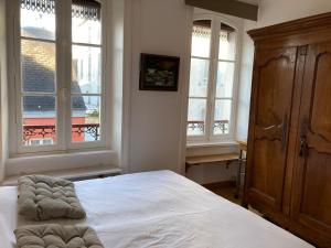 Łóżko lub łóżka w pokoju w obiekcie Appartement élégant 3* au coeur de Le Palais, 2 chambres, proche commerces et plage - FR-1-418-197